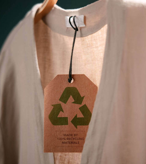 t-shirt on a hanger with a recyle tag
