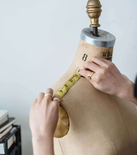 Body Positivity in Fashion Industry. The Rise of Inclusive Style on a dress form being measured.