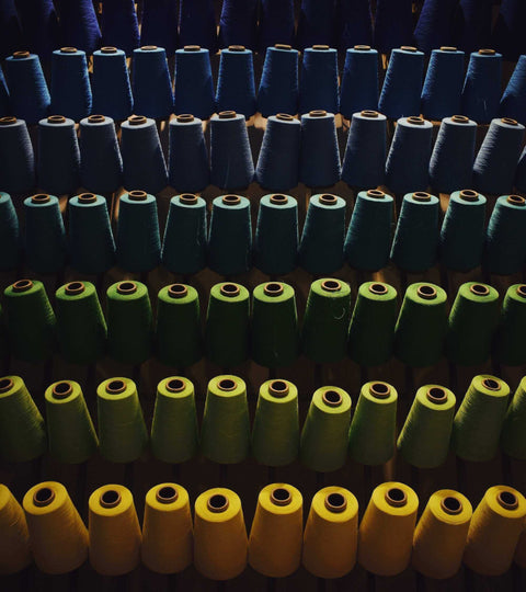 Reels of coloured fibres representing Circulose fabric benefits