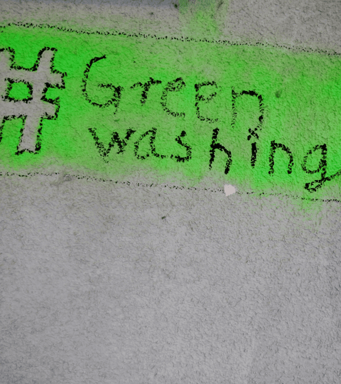 Graffiti asking the viewer to think, illustrating greenwashing in fashion marketing