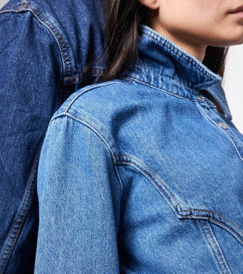Close-up of denim jackets representing sustainable fabric innovation in fashion.