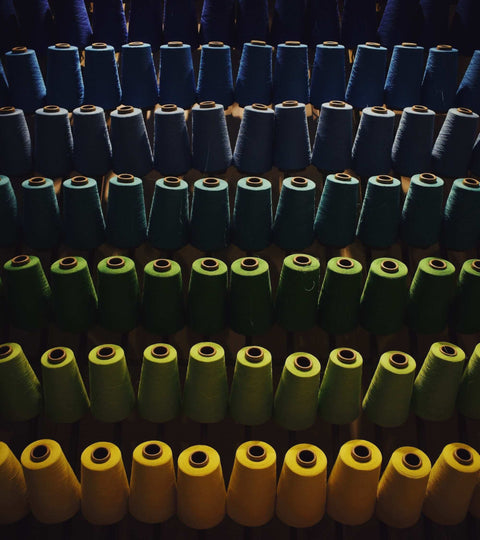 Reels of coloured fibres representing Circulose fabric benefits