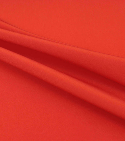 Red draped viscose fabric illustrating the viscose myth and questions around sustainable rayon