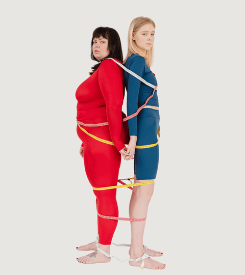 Two models with measuring tape illustrating second-hand sizing challenges