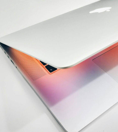 Close-up of a silver laptop with a colorful screen