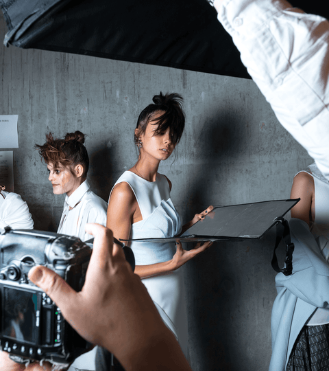 Models preparing for a fashion show, showcasing unique styles in the context of Reset Your Fashion Intention.