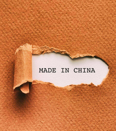 Torn Made in China label representing sustainable manufacturing in China