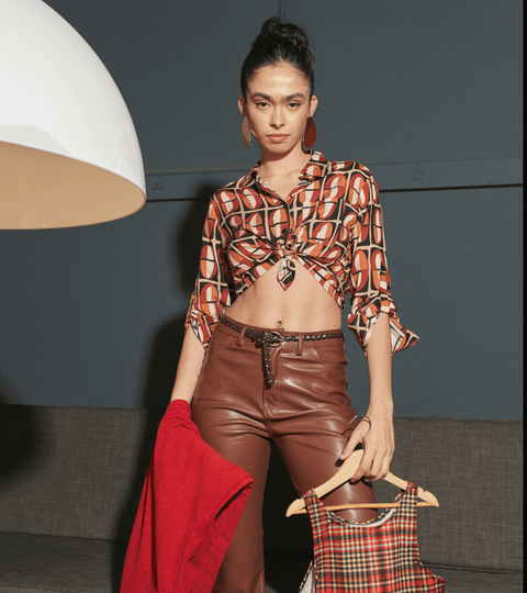 Model showcasing Bianca Spender sustainable fashion with stylish outfits and accessories.