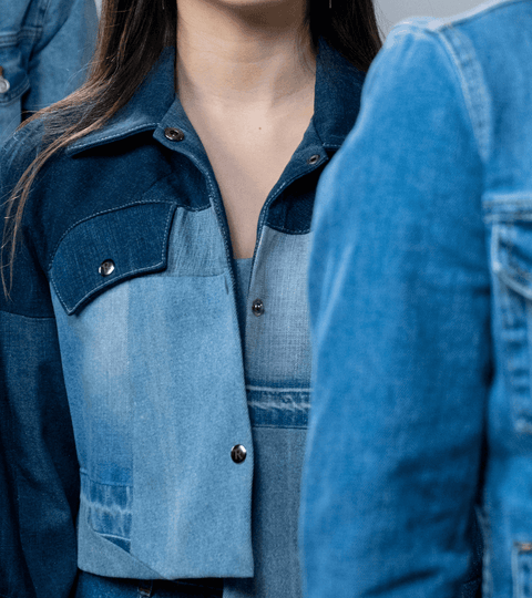 Models on a catwalk wearing denim
