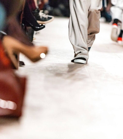 Close-up of models’ legs walking the runway at Fashion Week