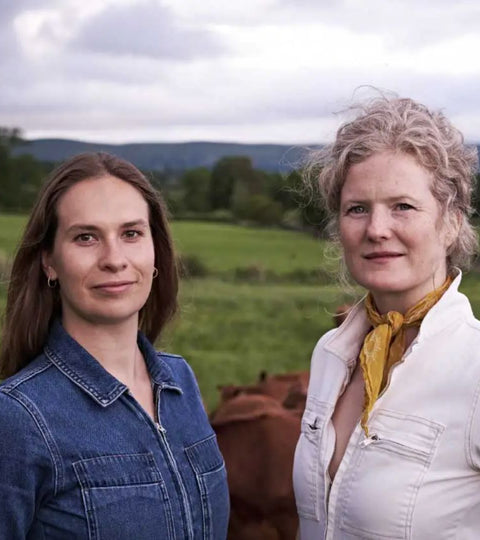 Founders of a regenerative leather company standing outdoors, representing sustainable farming and ethical fashion practices