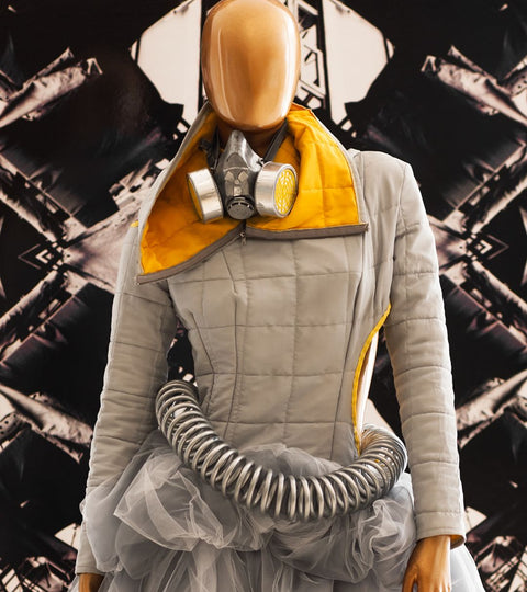 A humanoid robot wearing high end clothing