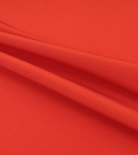 Red draped viscose fabric illustrating the viscose myth and questions around sustainable rayon
