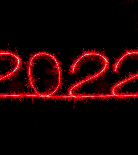Short term health goals and new beginnings represented by glowing 2022 sparks
