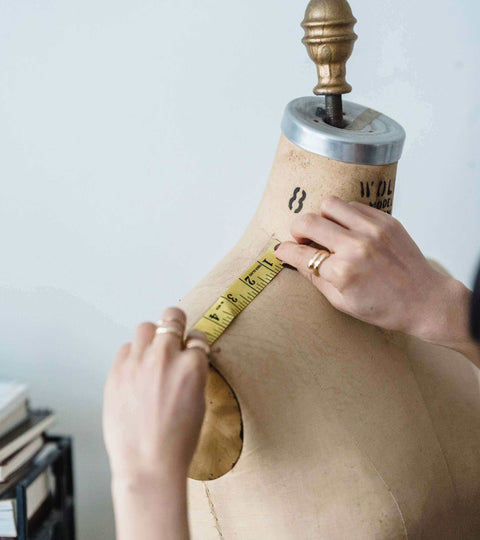 Body Positivity in Fashion Industry. The Rise of Inclusive Style on a dress form being measured.