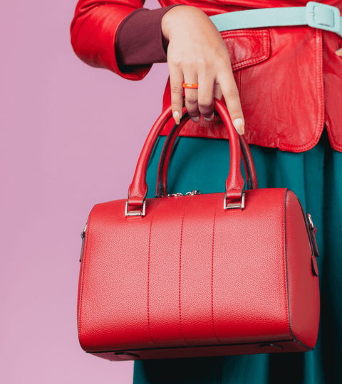 Stylish red handbag showcasing leather alternatives UK from sustainable materials.