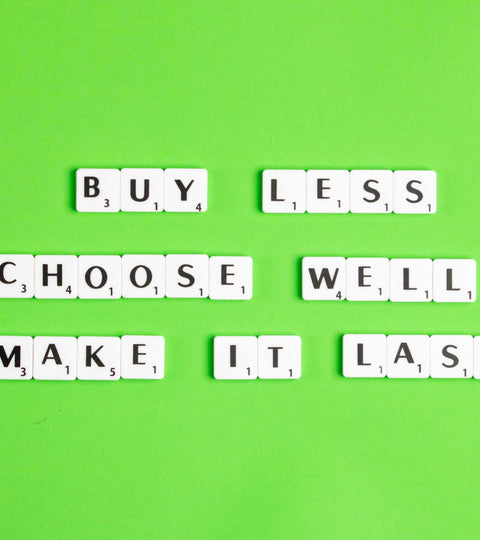 Circular fashion future message with scrabble letters spelling buy less choose well and make it last