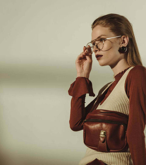 Stylish woman holding a handbag representing ethical B Corp fashion brands