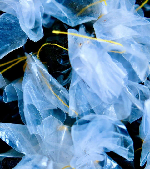 Close-up of plastic pieces representing the shift towards circular polyester and reducing virgin plastic.