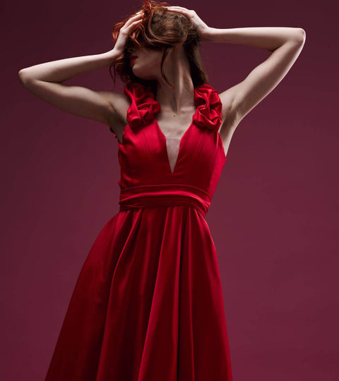 Stunning red dress showcased in fashion houses changing creative directors, highlighting elegance and style.