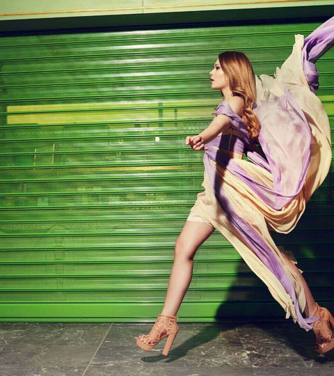 Model wearing flowing clothing representing biodegradable fashion benefits