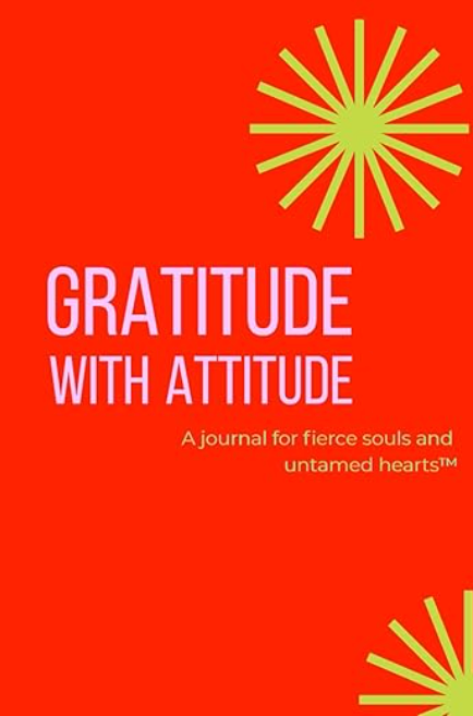 Book cover with red background, green starburst designs, and text: Gratitude with Attitude. A journal for fierce souls and untamed hearts™ in purple and gold lettering.
